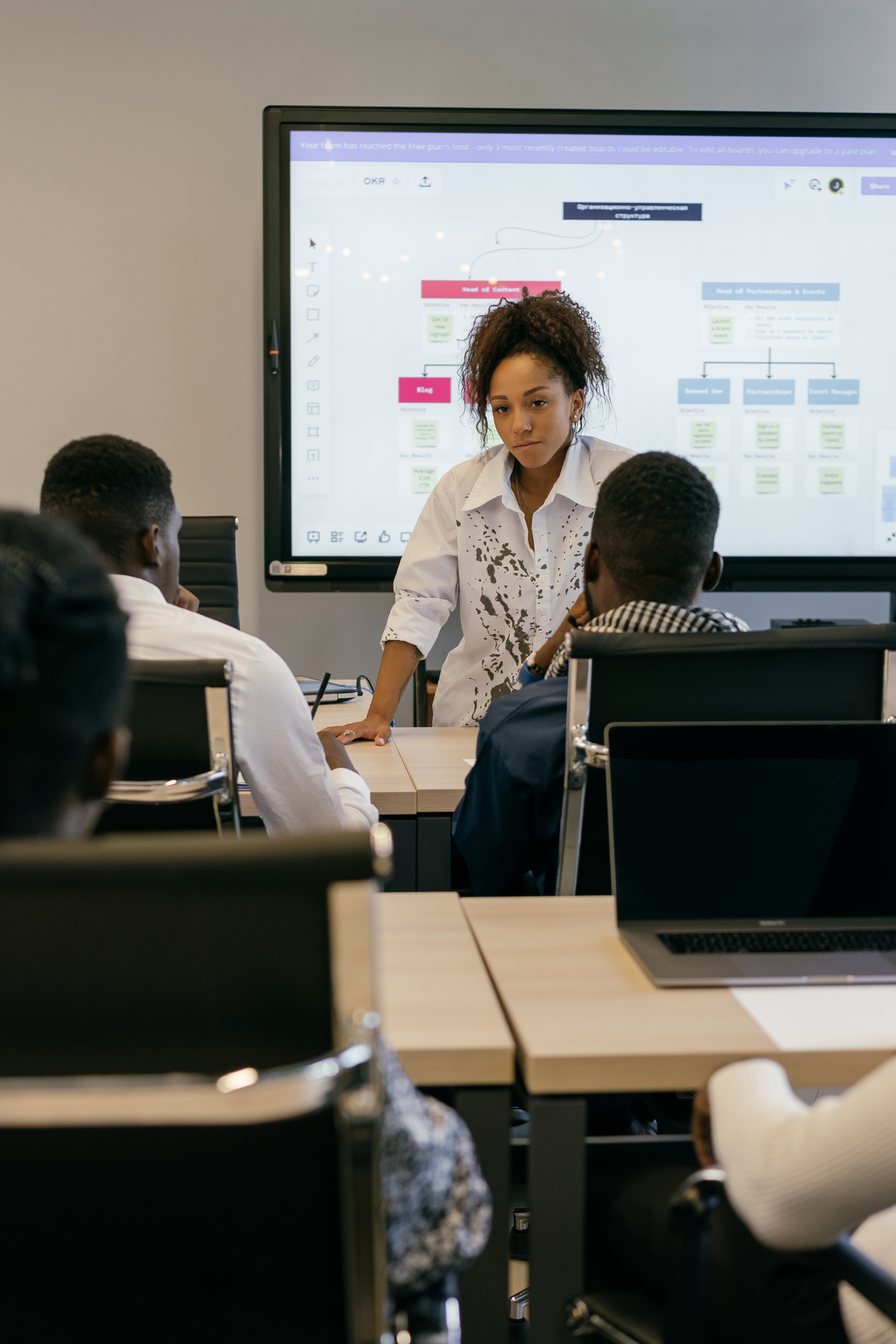 A person teaching a classroom.